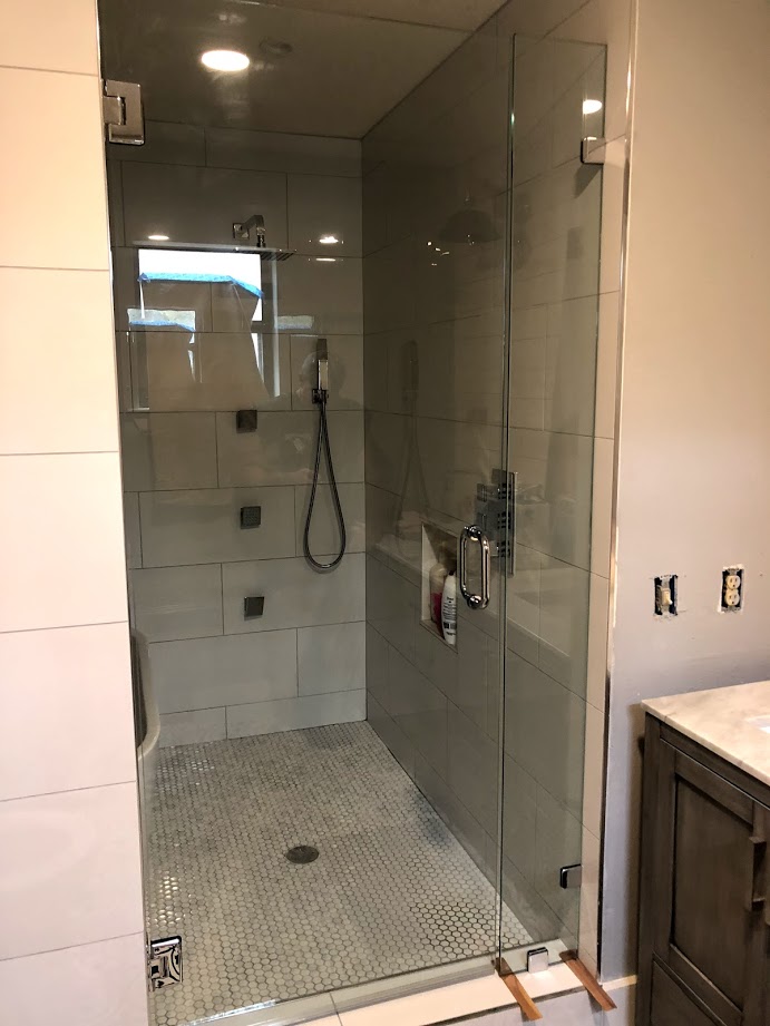 Two-piece frameless shower doors