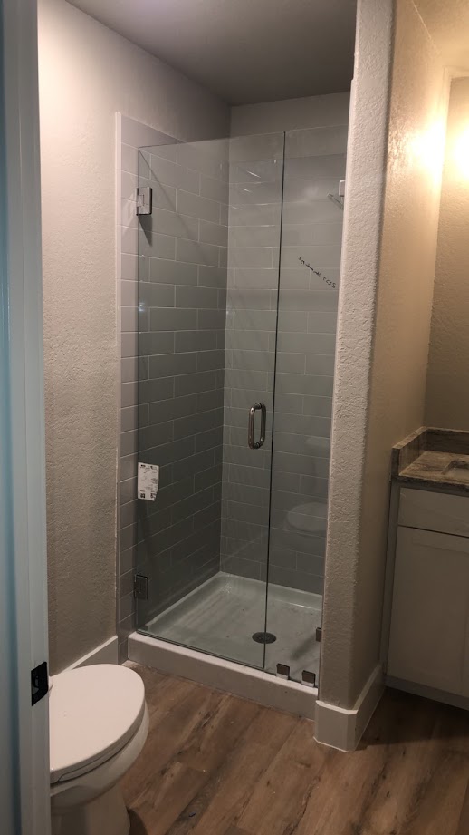 Two-piece frameless shower doors