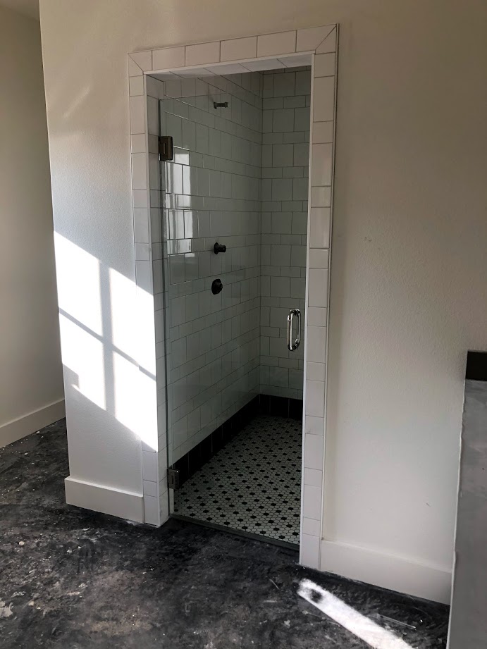 One-piece frameless shower doors