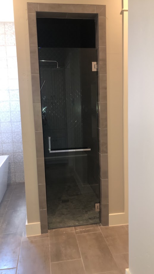 One-piece frameless shower doors
