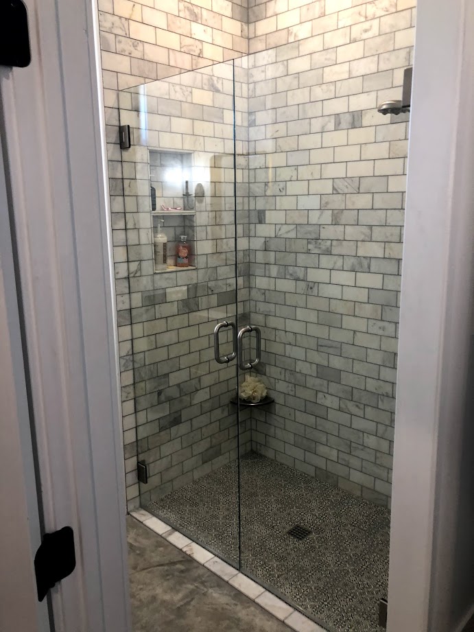 Two-piece frameless shower doors