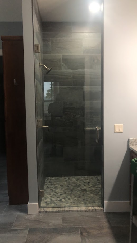 One-piece frameless shower doors